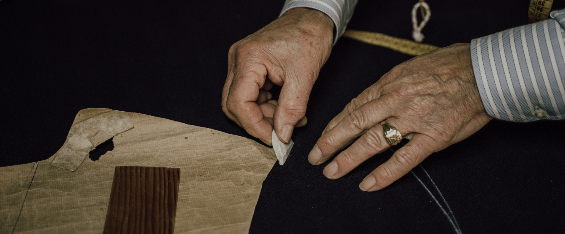 a close up of a person cutting a piece of paper