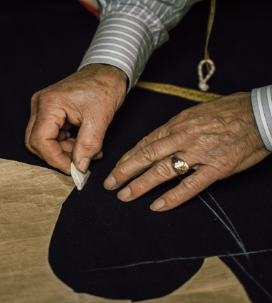 a close up of a person cutting a piece of paper